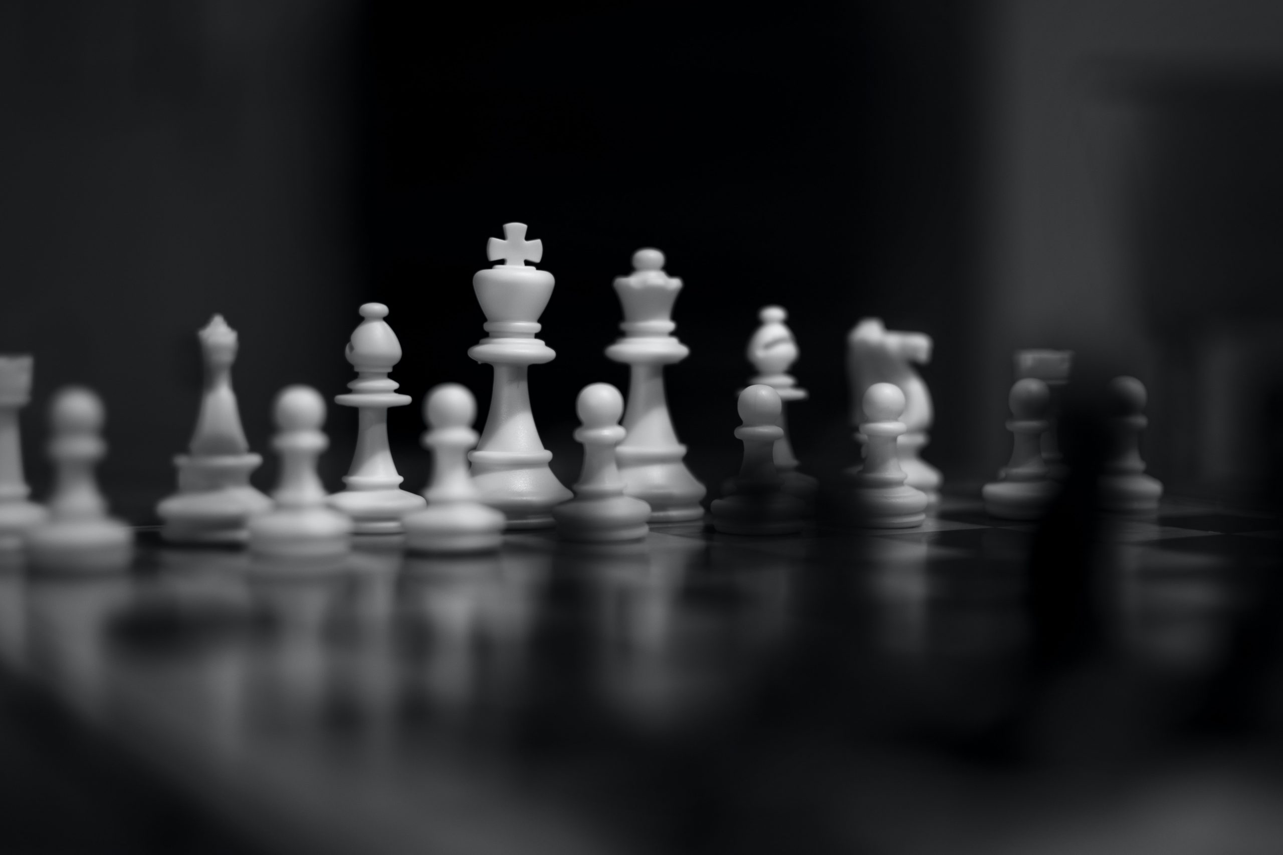 White chess piece on black table photo – Free Dubai - united arab emirates  Image on Unsplash